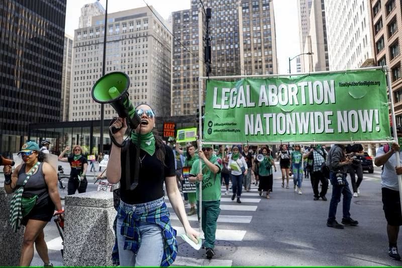 Allyson Nogaj leads the “Fascist Judges: Keep Your Hands Off Abortion Medication” nationwide protest along the streets of downtown Chicago on April 15, 2023. (Shanna Madison / Chicago Tribune)