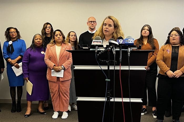 Flanked by domestic violence advocates and a pair of state senators, State Rep. Maura Hirschauer, D-Batavia, speaks at a Chicago news conference on Thursday announcing intentions to run a gun-related proposal during the General Assembly’s fall veto session later this month. Hirschauer’s bill would require law enforcement to confiscate guns from those with domestic violence orders of protection within 48 hours of a judge granting an order. (Capitol News Illinois photo by Hannah Meisel)